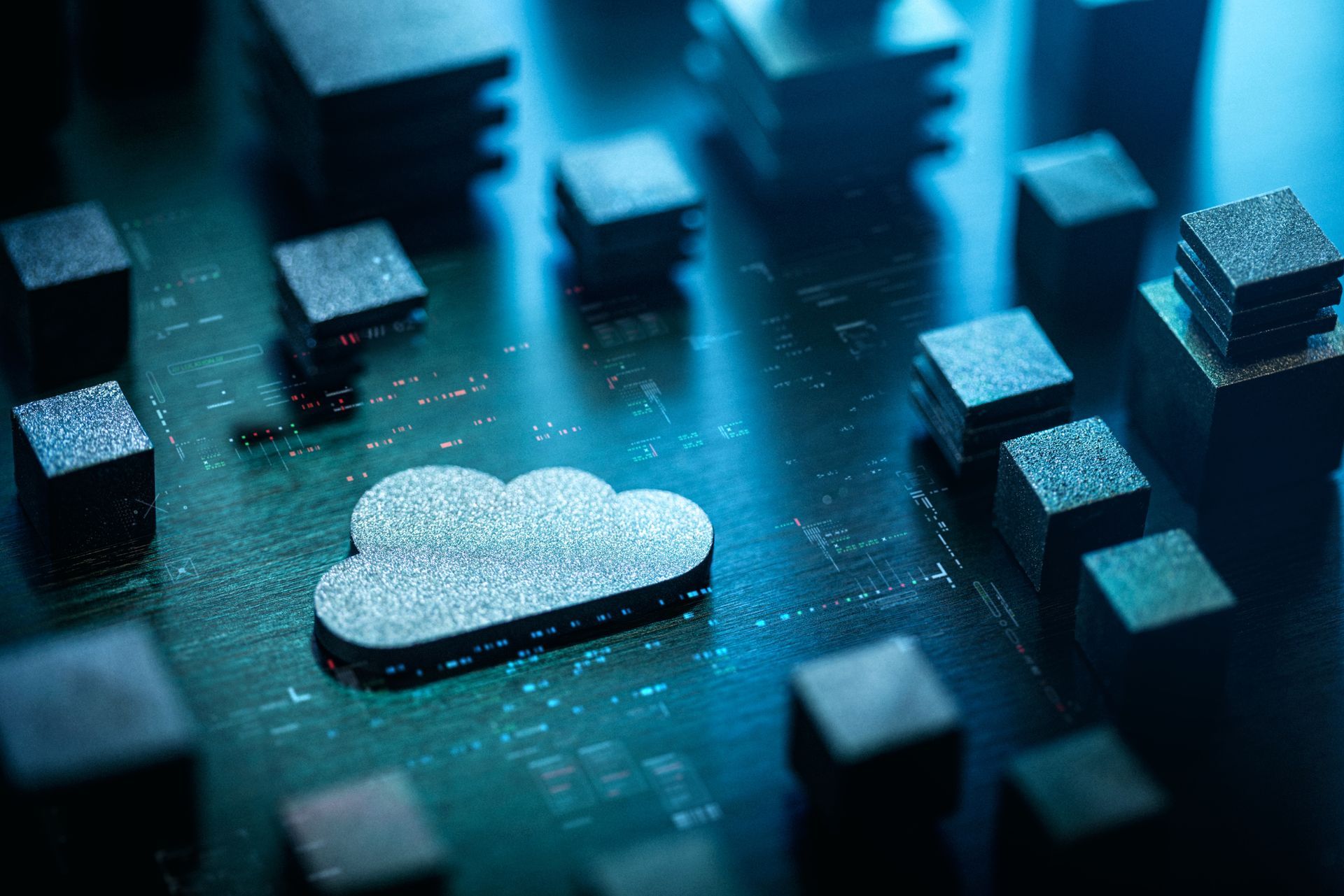 A cloud icon on a circuit board surrounded by electronic components in a close-up