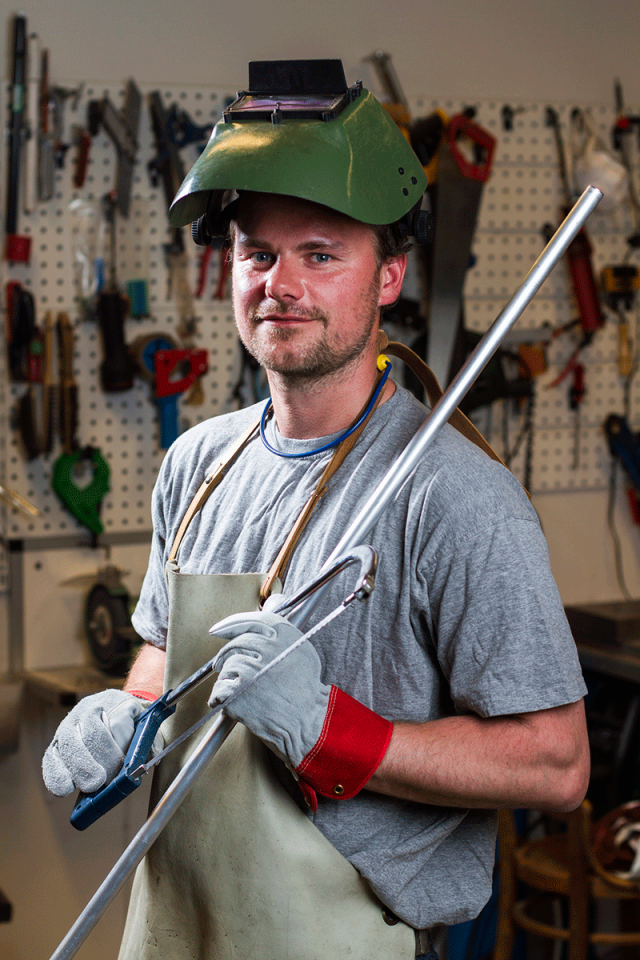 Welder Holding a Saw — DFW Airport, TX — Steel Service Center