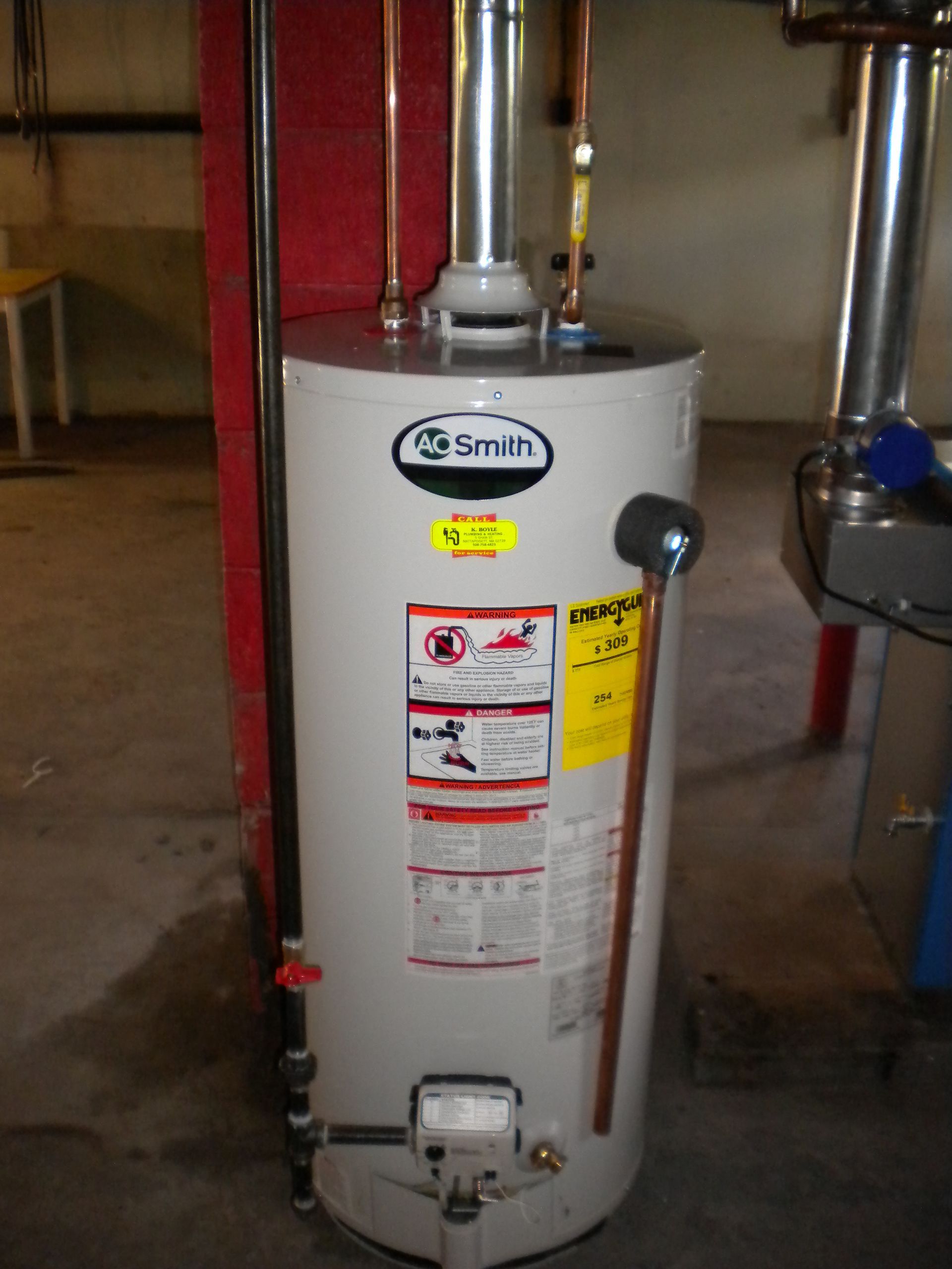 A smith water heater is sitting in a basement