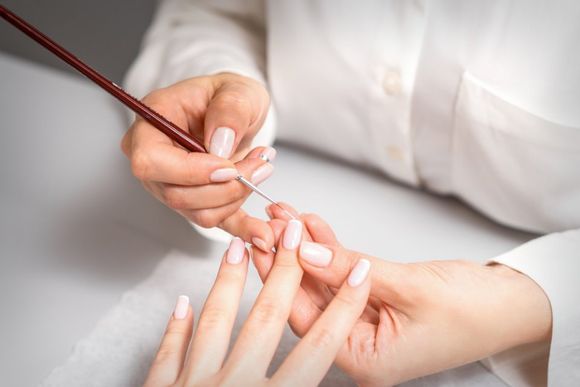 manicure master doing a french manicure