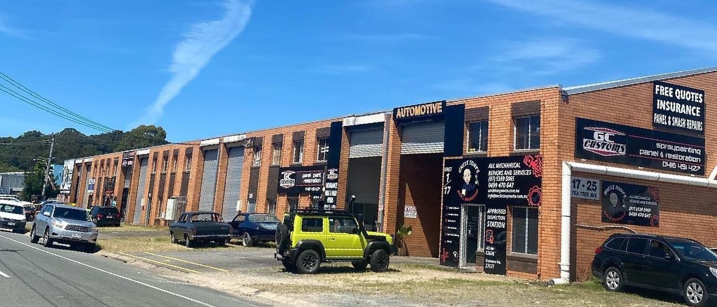A Man Is Working On The Engine Of A Forklift — Uncle Tonys Auto And Mechanical In Currumbin Waters, QLD