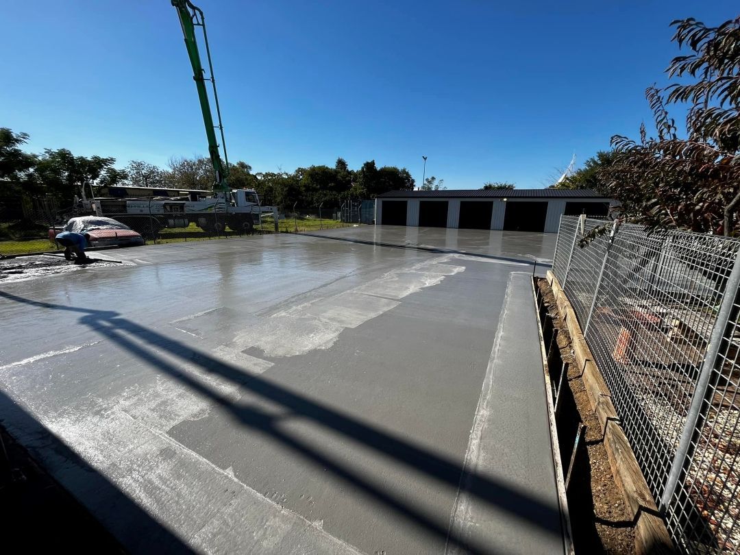 A Concrete Floor is Being Poured by a Crane — All Aspects Concreting & Earthworks Pty Ltd in Wellington, NSW