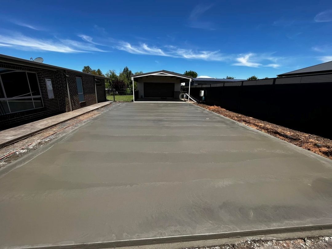 A Concrete Driveway is Being Built in Front of a House — All Aspects Concreting & Earthworks Pty Ltd in Singleton, NSW