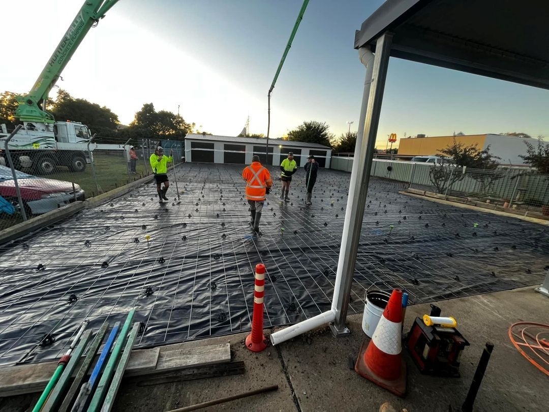 Group of Construction Workers Are Working on Concrete Driveway — All Aspects Concreting & Earthworks Pty Ltd in Maitland, NSW