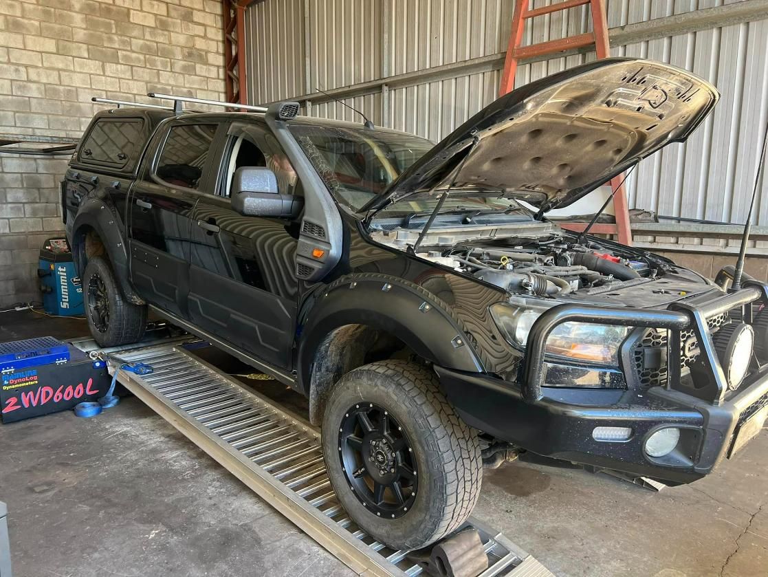 Black SUV With The Hood Up Is Parked In A Garage — Chrisp Performance in Emerald, QLD