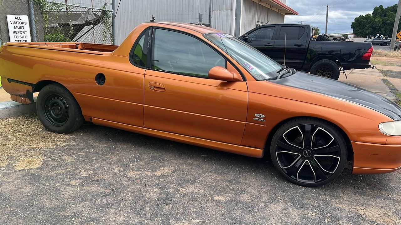 Orange Pick Up Truck Parked On The Side Of The Road — Chrisp Performance in Emerald, QLD