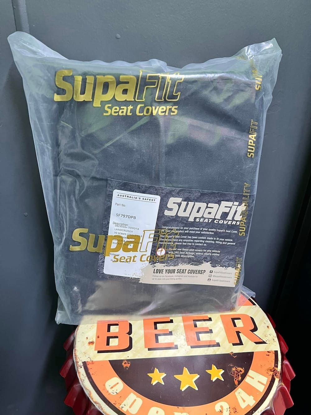 A Bag of Seat Covers is Sitting on Top of a Beer Sign — Chrisp Performance in Emerald, QLD