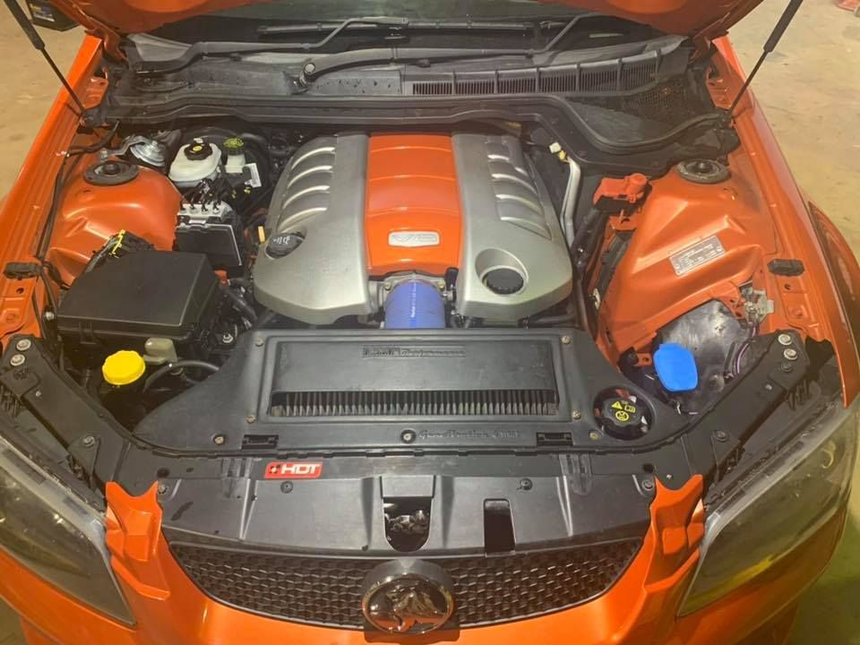 Engine Of An Orange Car — Chrisp Performance in Emerald, QLD