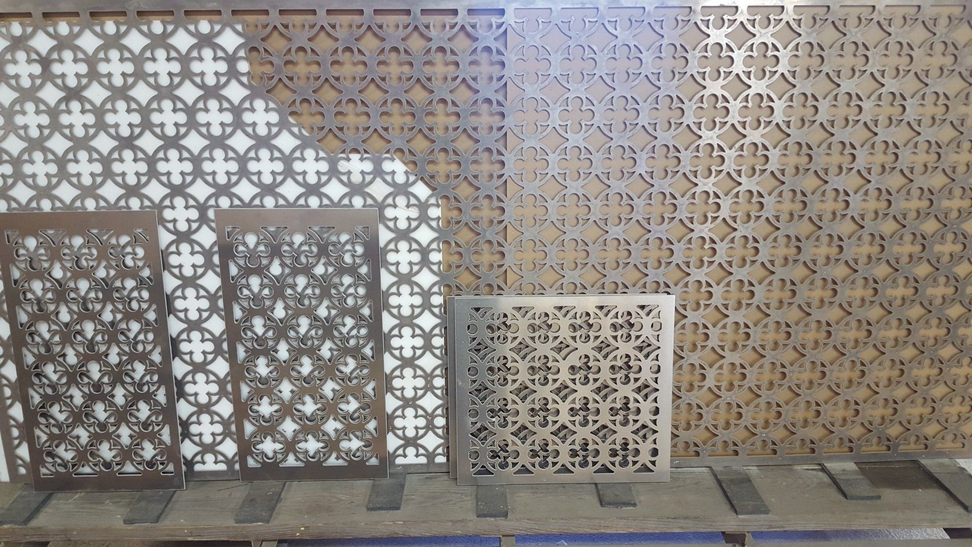 A bunch of pieces of metal with a pattern on them