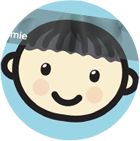 A cartoon boy 's face is smiling in a blue circle.