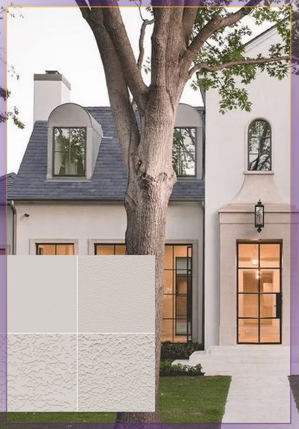 Modern white house exterior with large tree, gray roof, lit windows, and a small front lawn