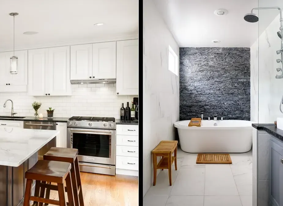 Bright white kitchen beside a modern bathroom with a freestanding tub and dark tiled accent wall