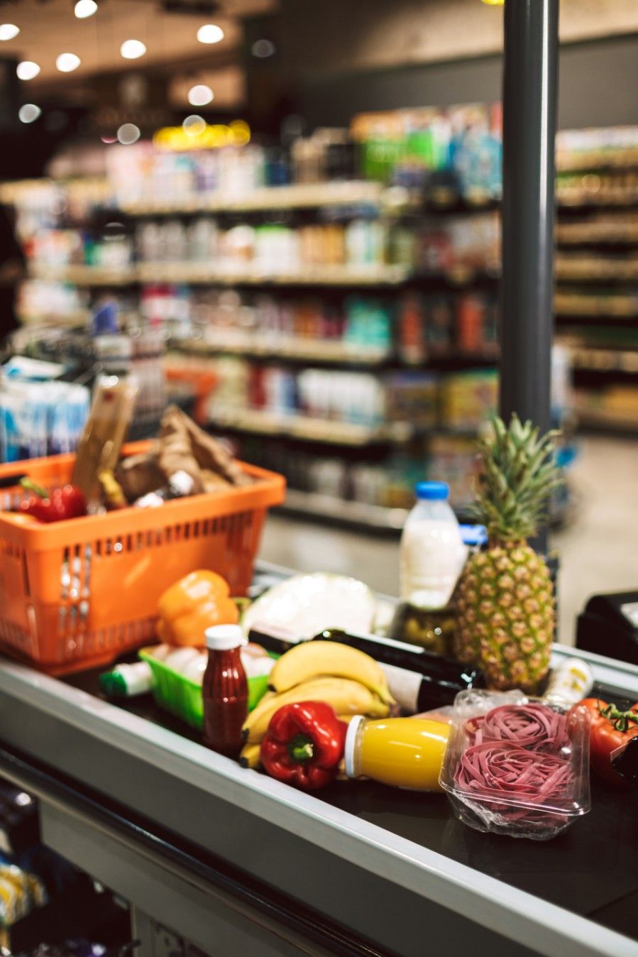 A Conveyor Belt Filled With Fruits And Vegetables In A Grocery Store