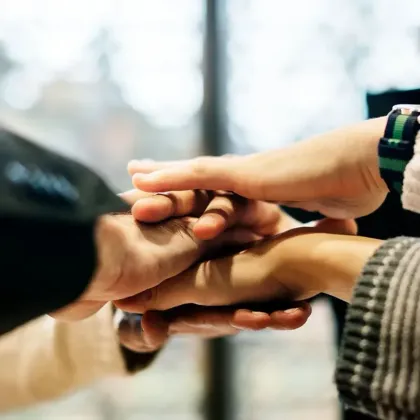 Hands joined together symbolising partnership, collaboration, and support for FMCG brands