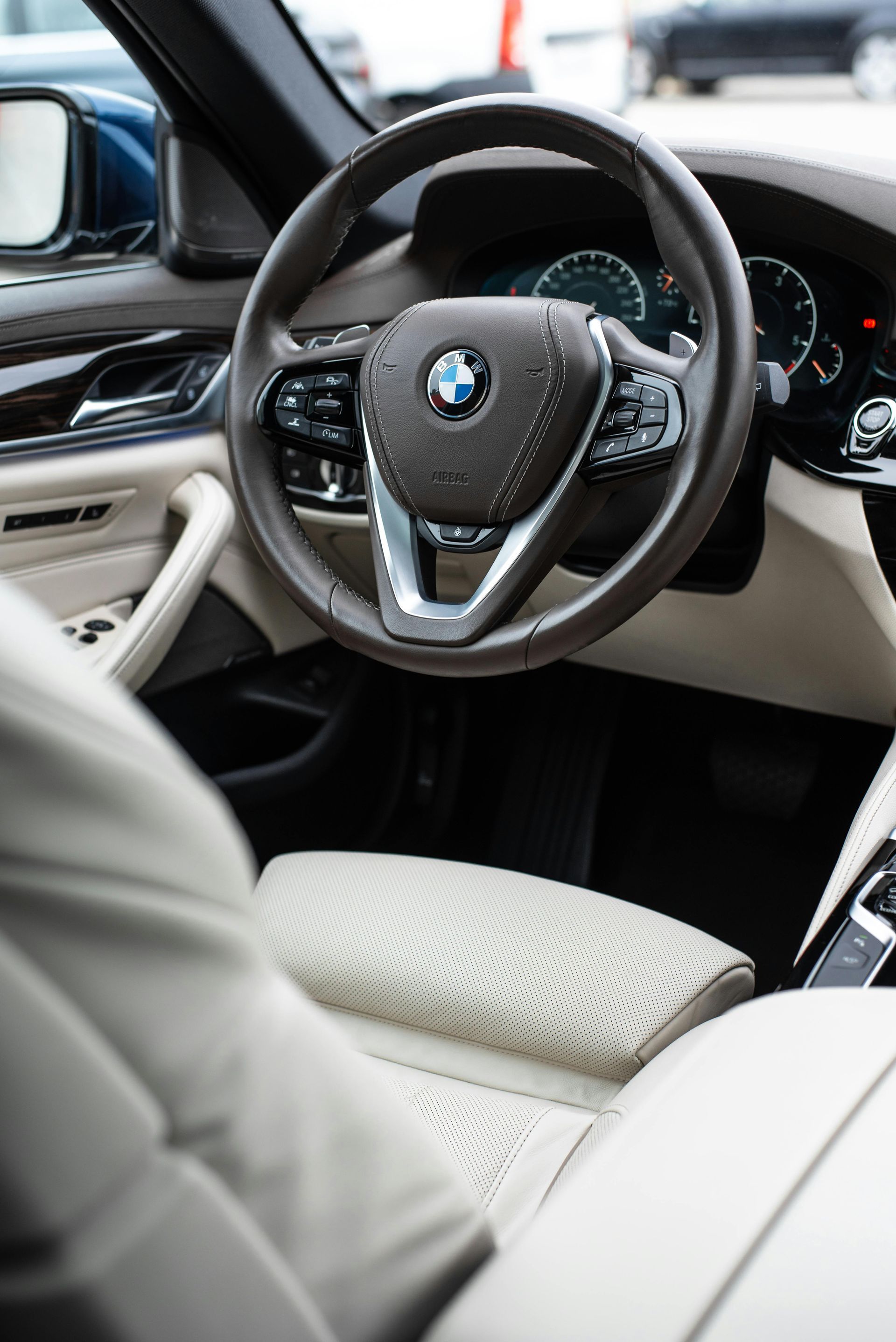 Clean BMW interior with leather seats and steering wheel after an Interior detail at Supreme Car Care in Old Bridge, NJ