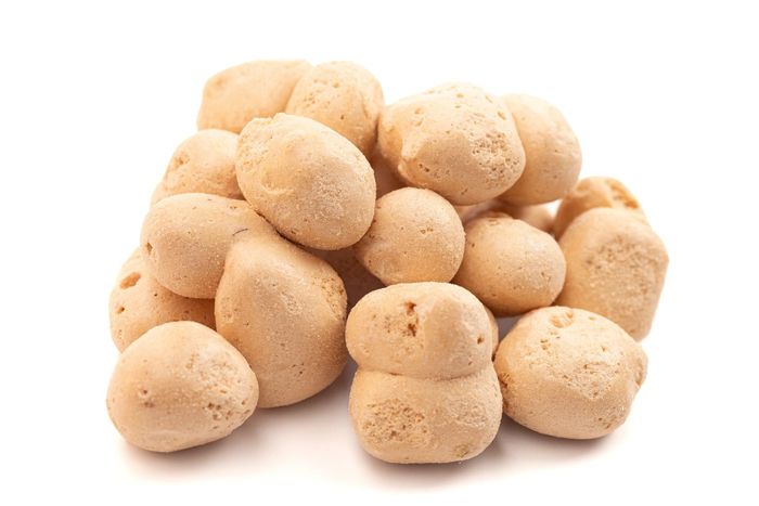 A pile of freeze dried candy on a white background