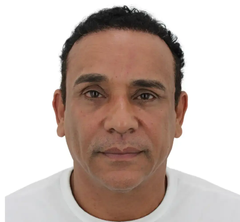 Man with dark hair and brown eyes, looking directly at the camera.
