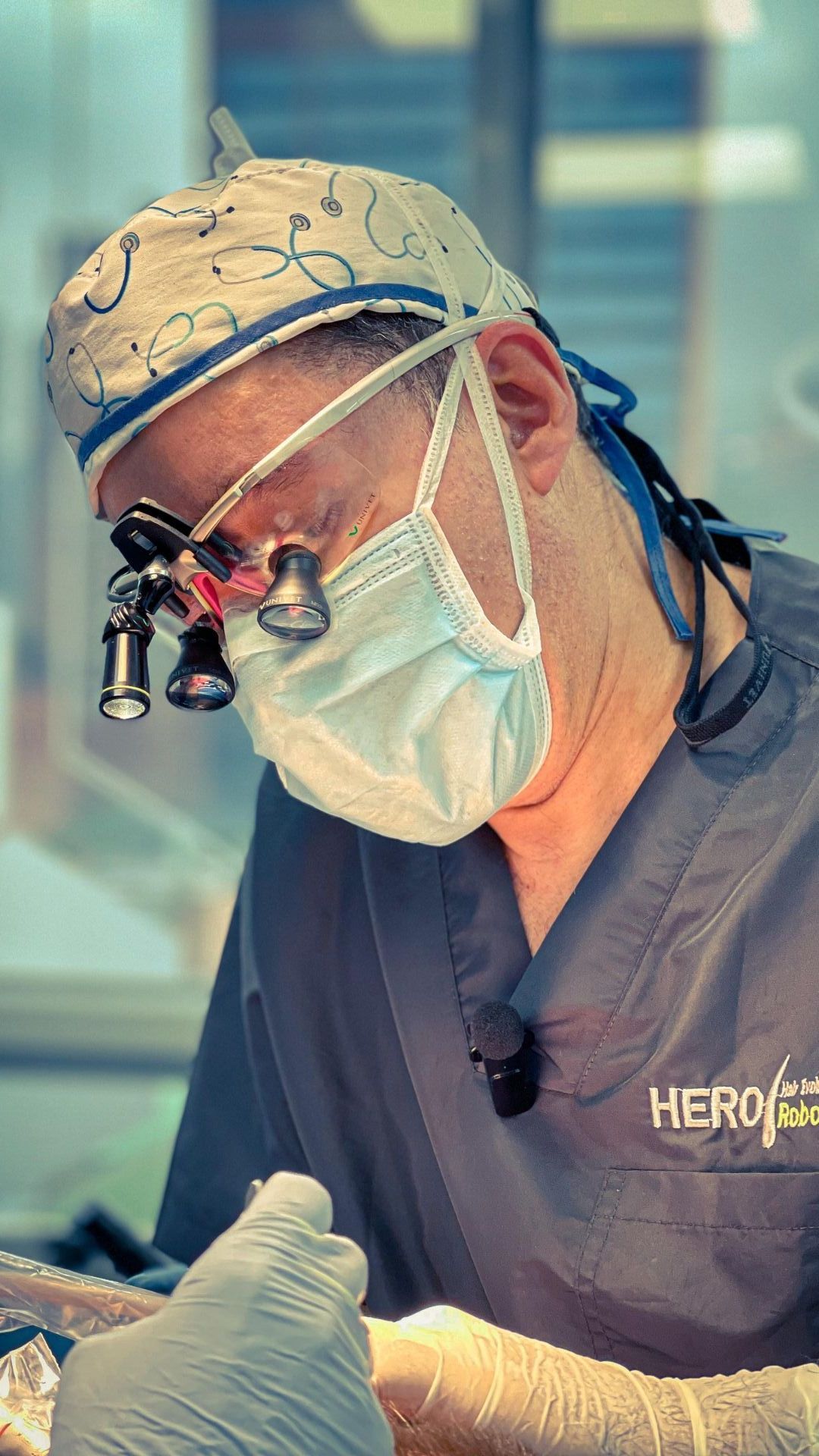 A group of surgeons in Colombia are operating on a patient in an operating room.