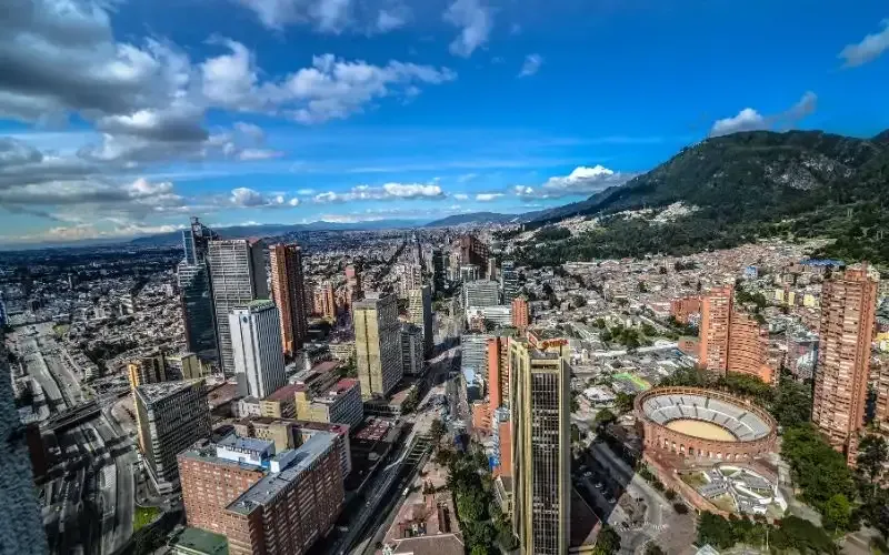 An aerial view of Bogotá Colombia with a mountain in the background.