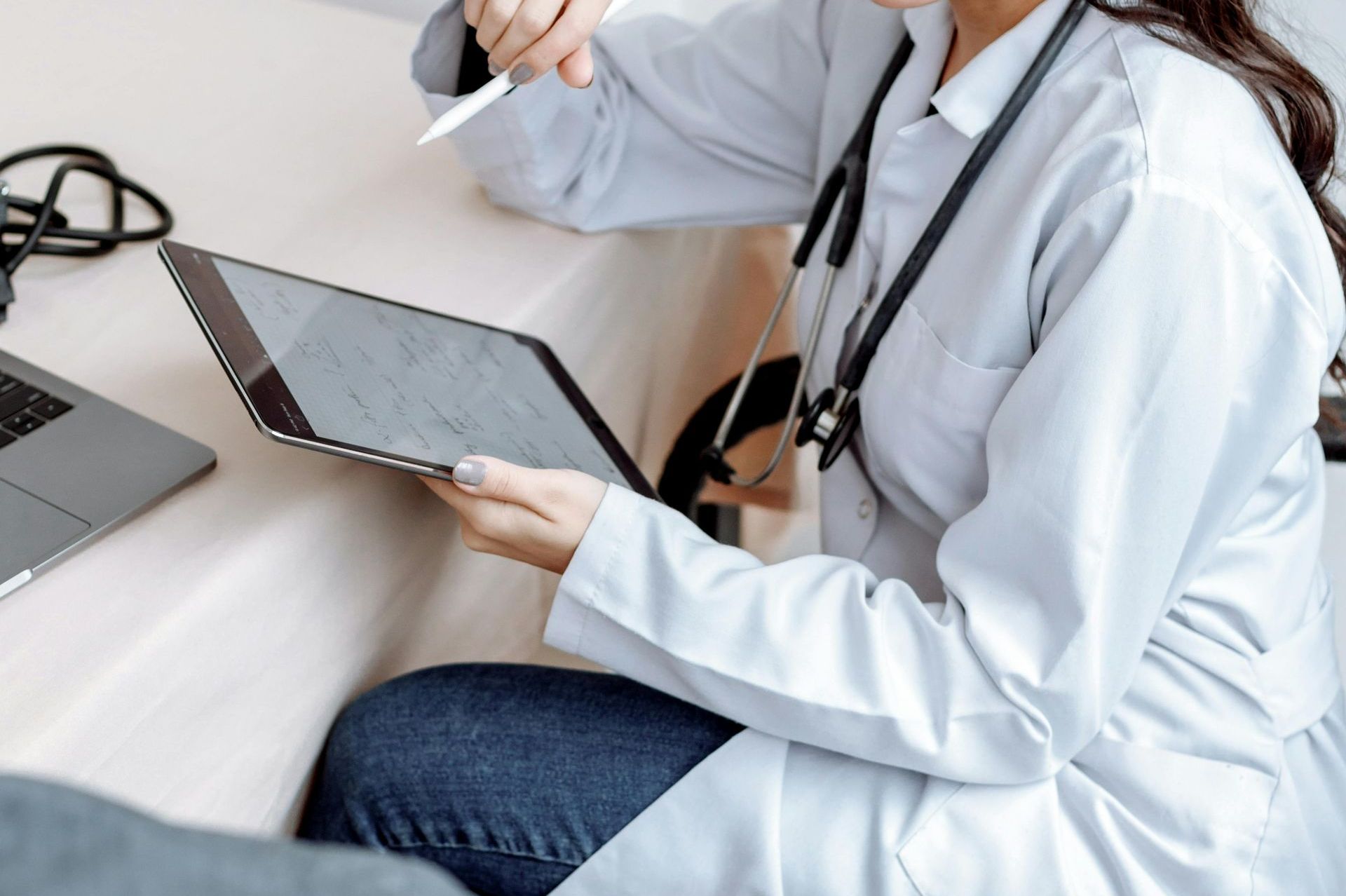 A female doctor does checkup before hairline surgery.
