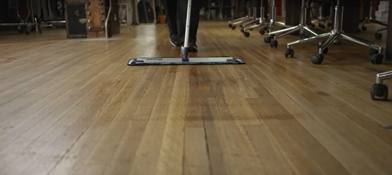 man cleaning office floor