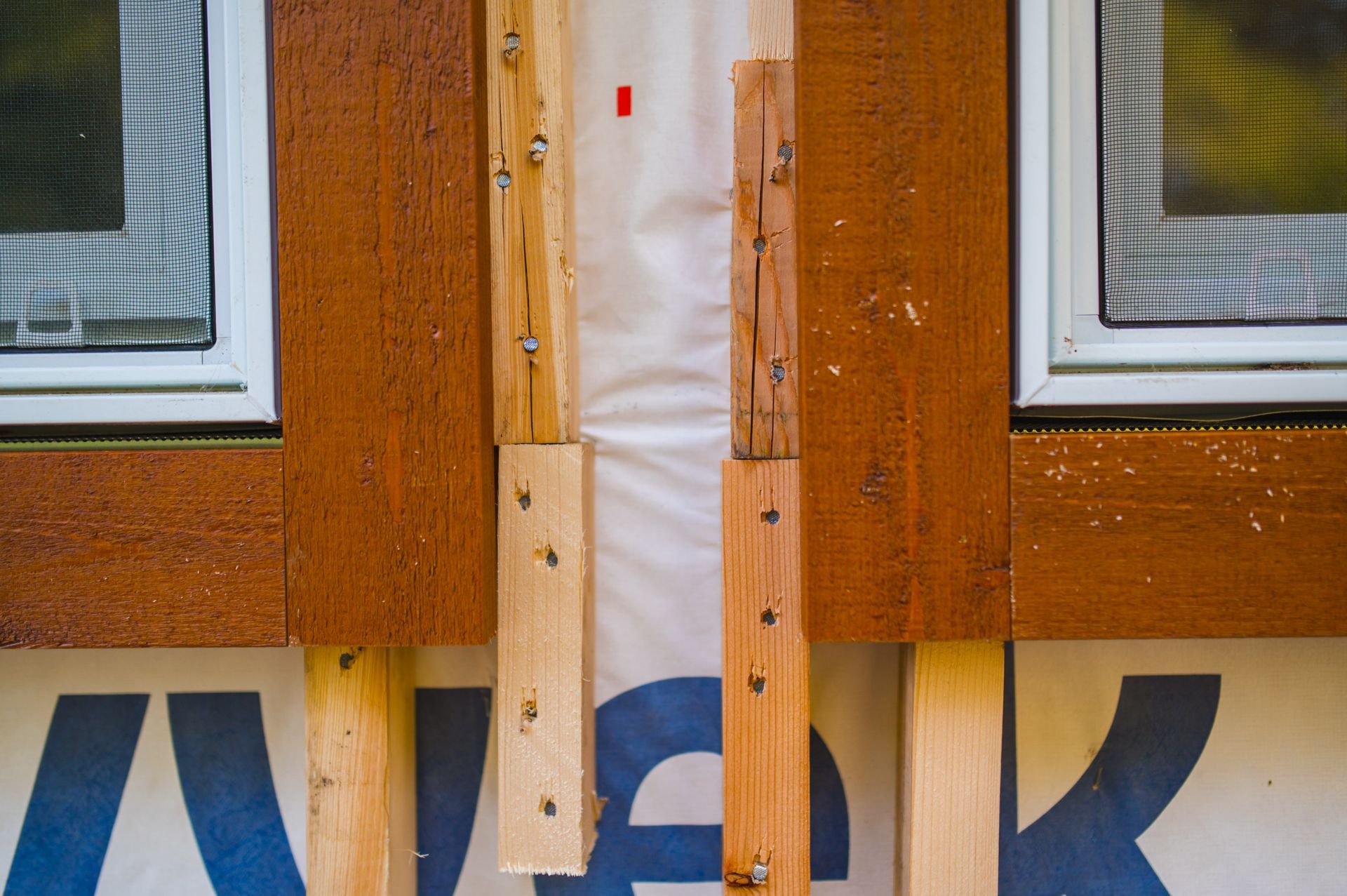 A close up of a window with a screen on it