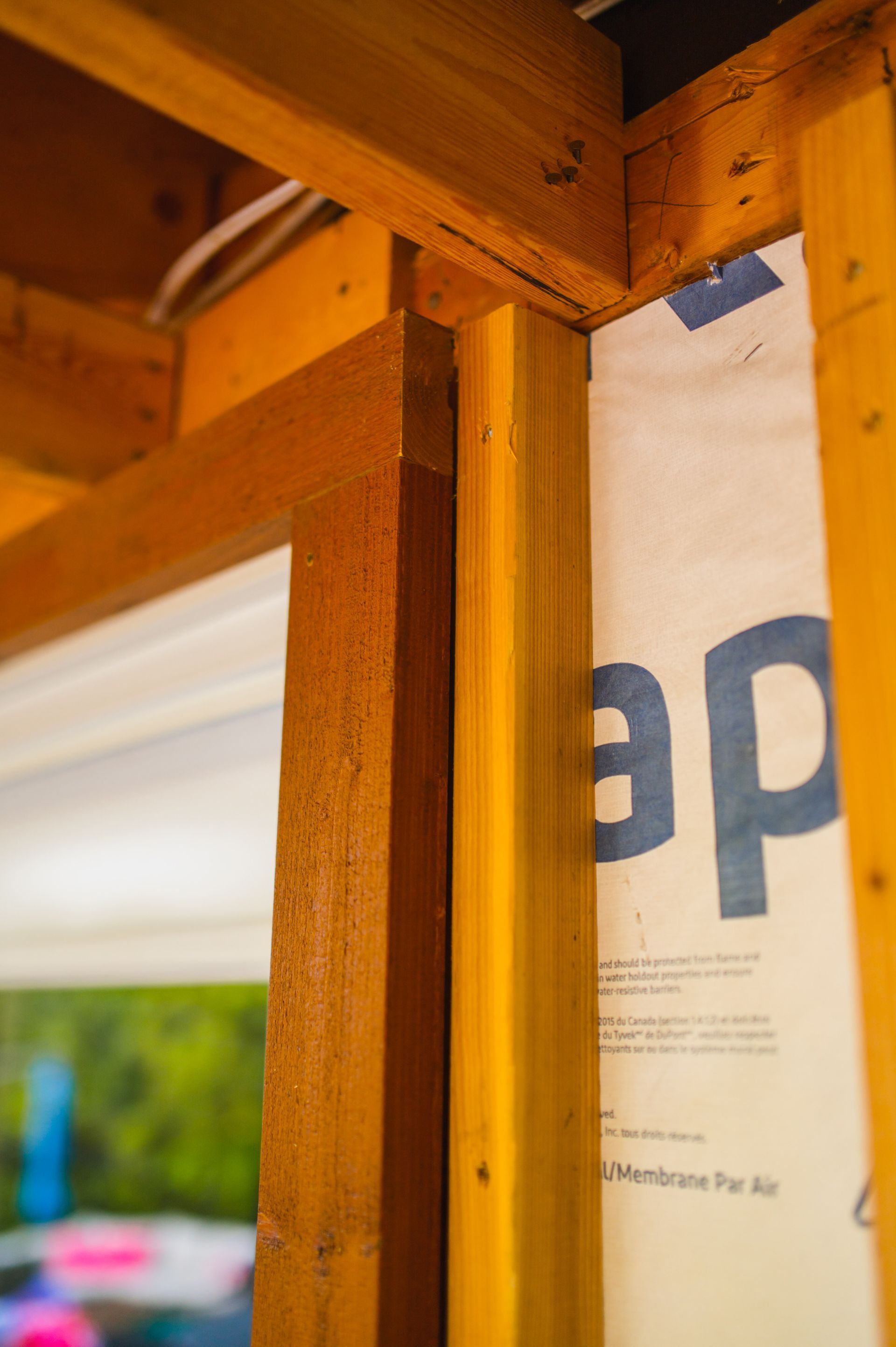 A close up of a wooden frame with a piece of paper that says ap on it.