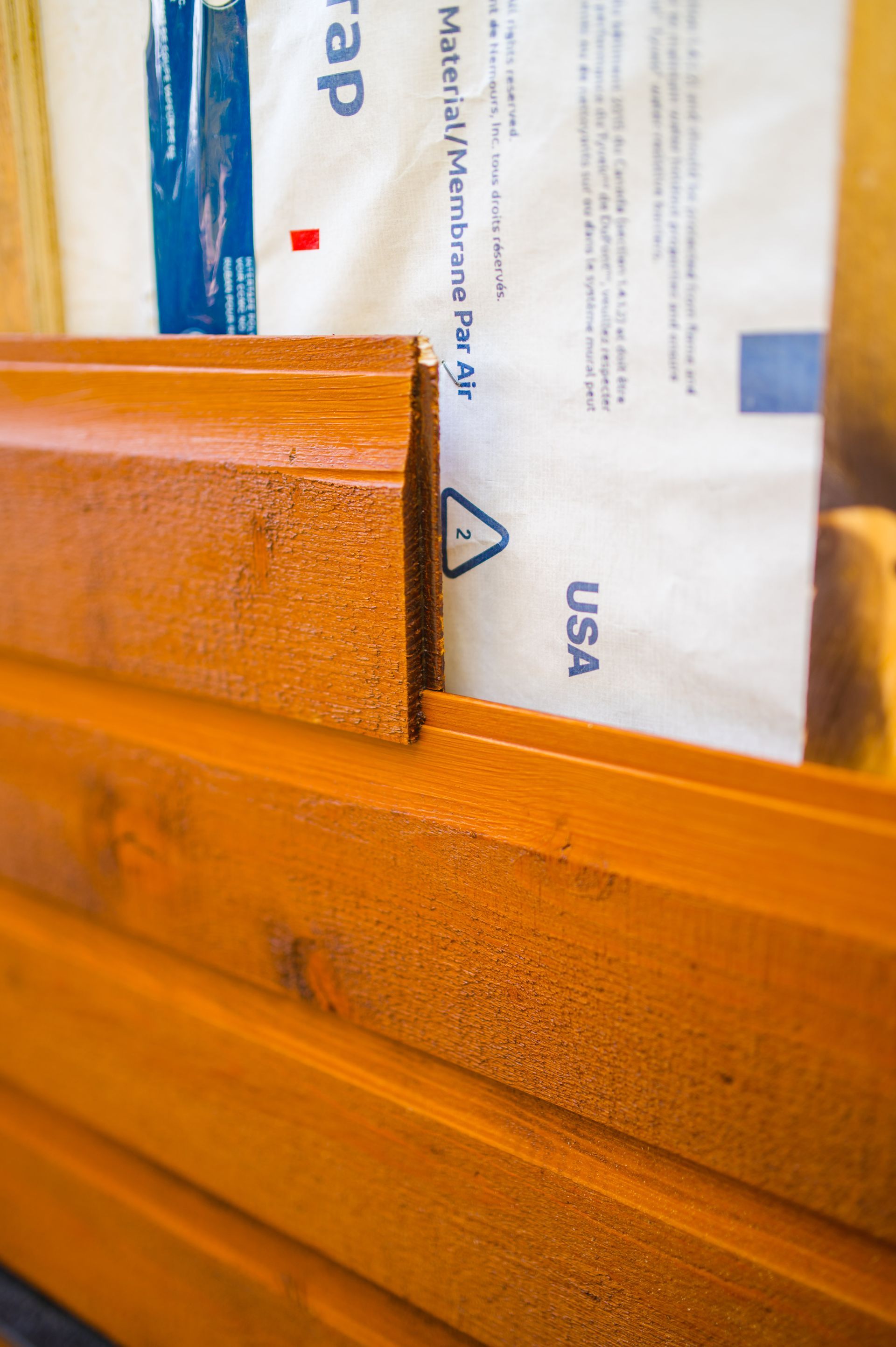 A close up of a piece of wood with a piece of paper on it.