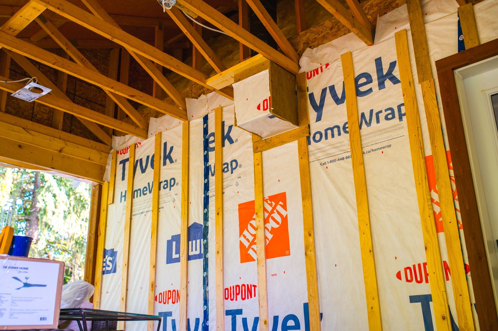 A house is being built with the word home wrap on the wall