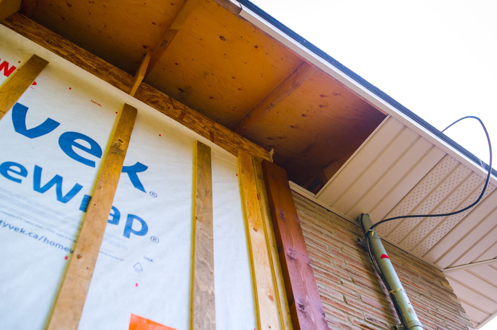 A house is being built and the roof is covered with a vek wrap