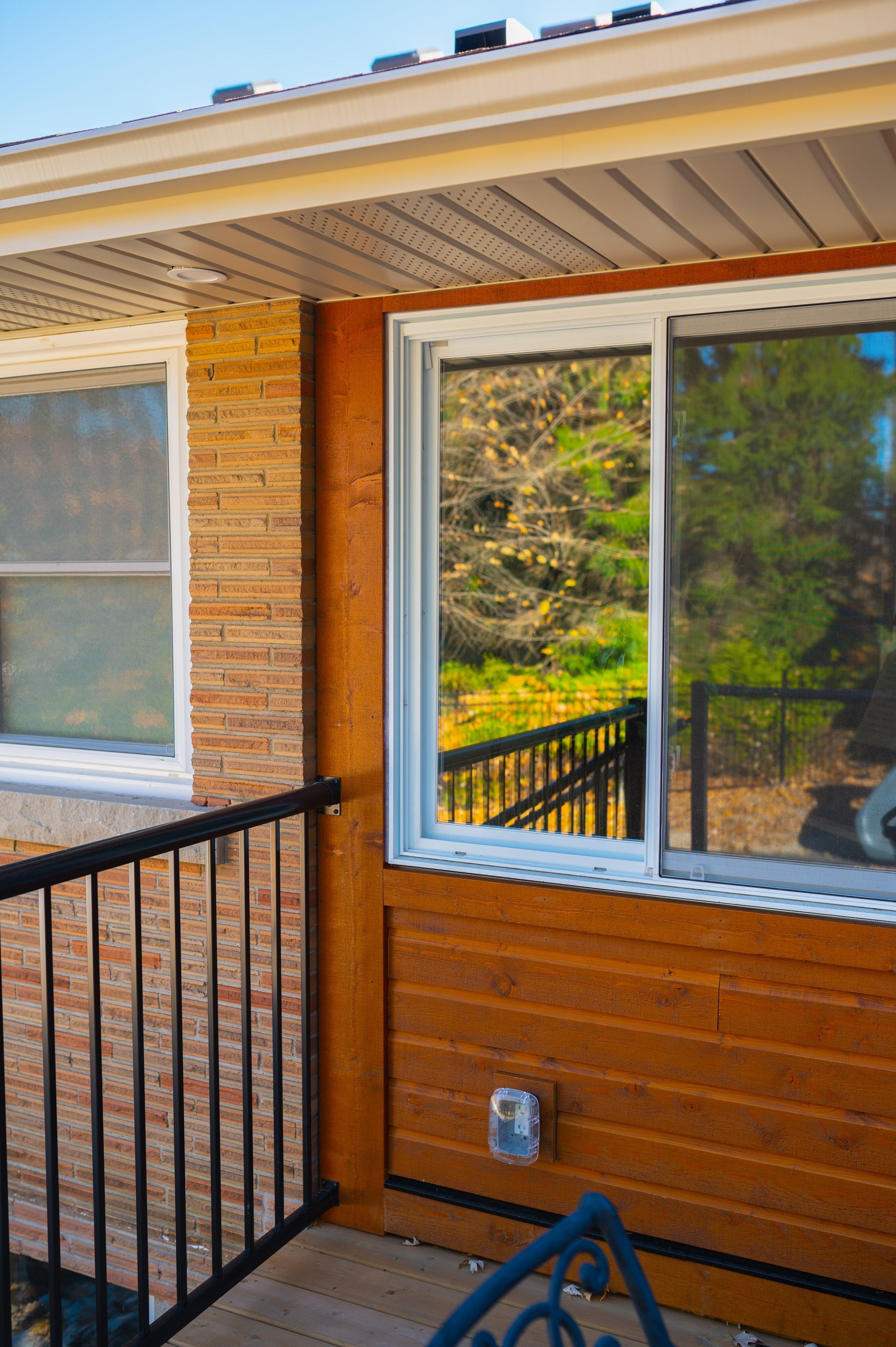 There is a sliding glass door on the side of the house.