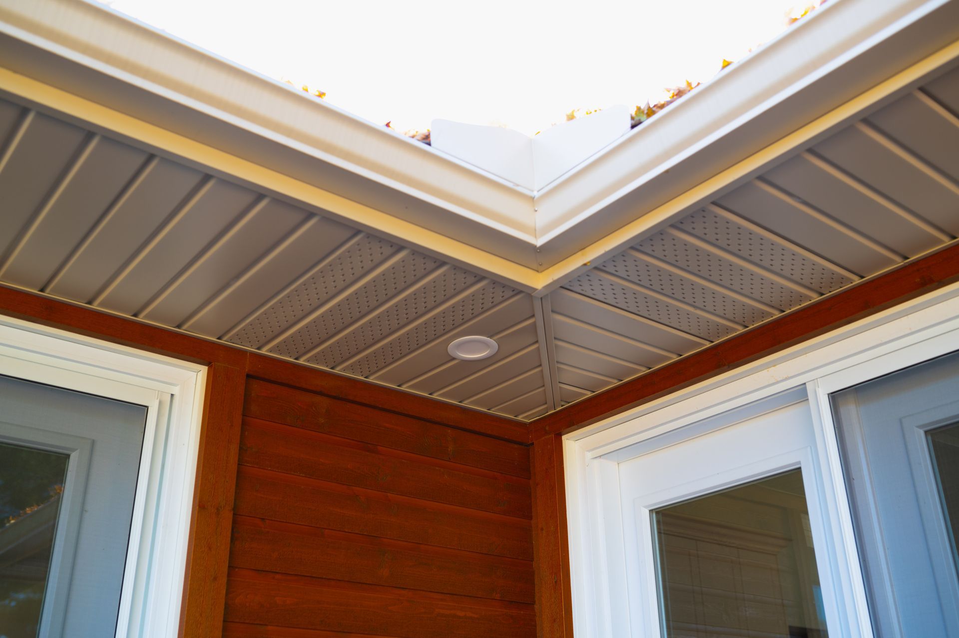 Looking up at the ceiling of a house with two windows