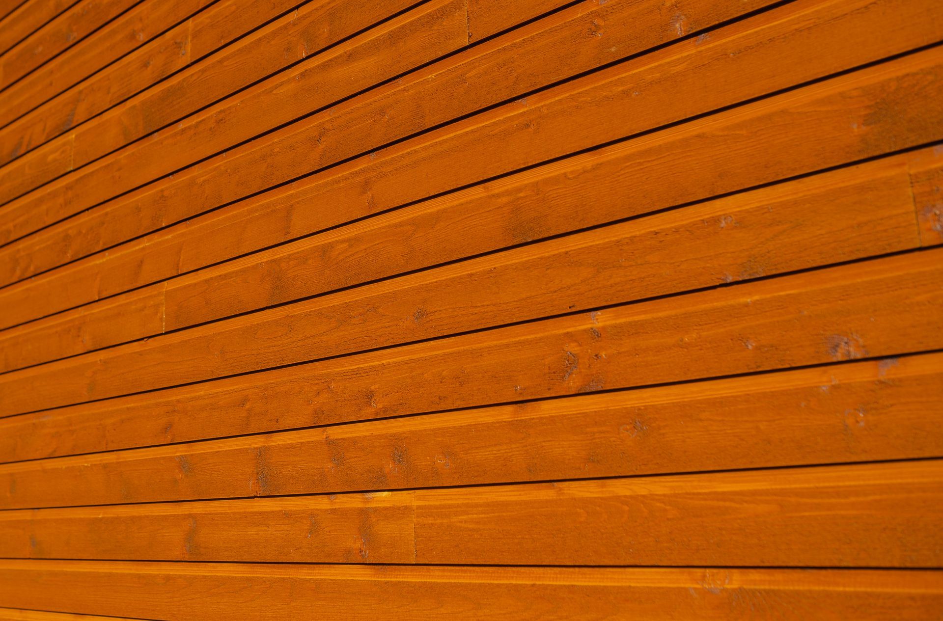 A close up of a wooden wall with a striped pattern