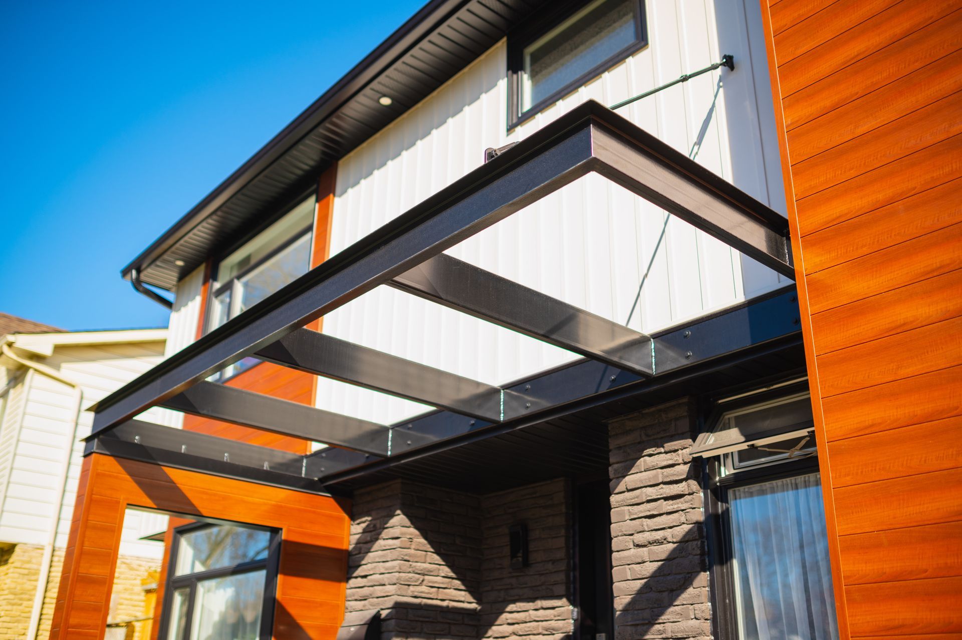 A house with a canopy over the front door.