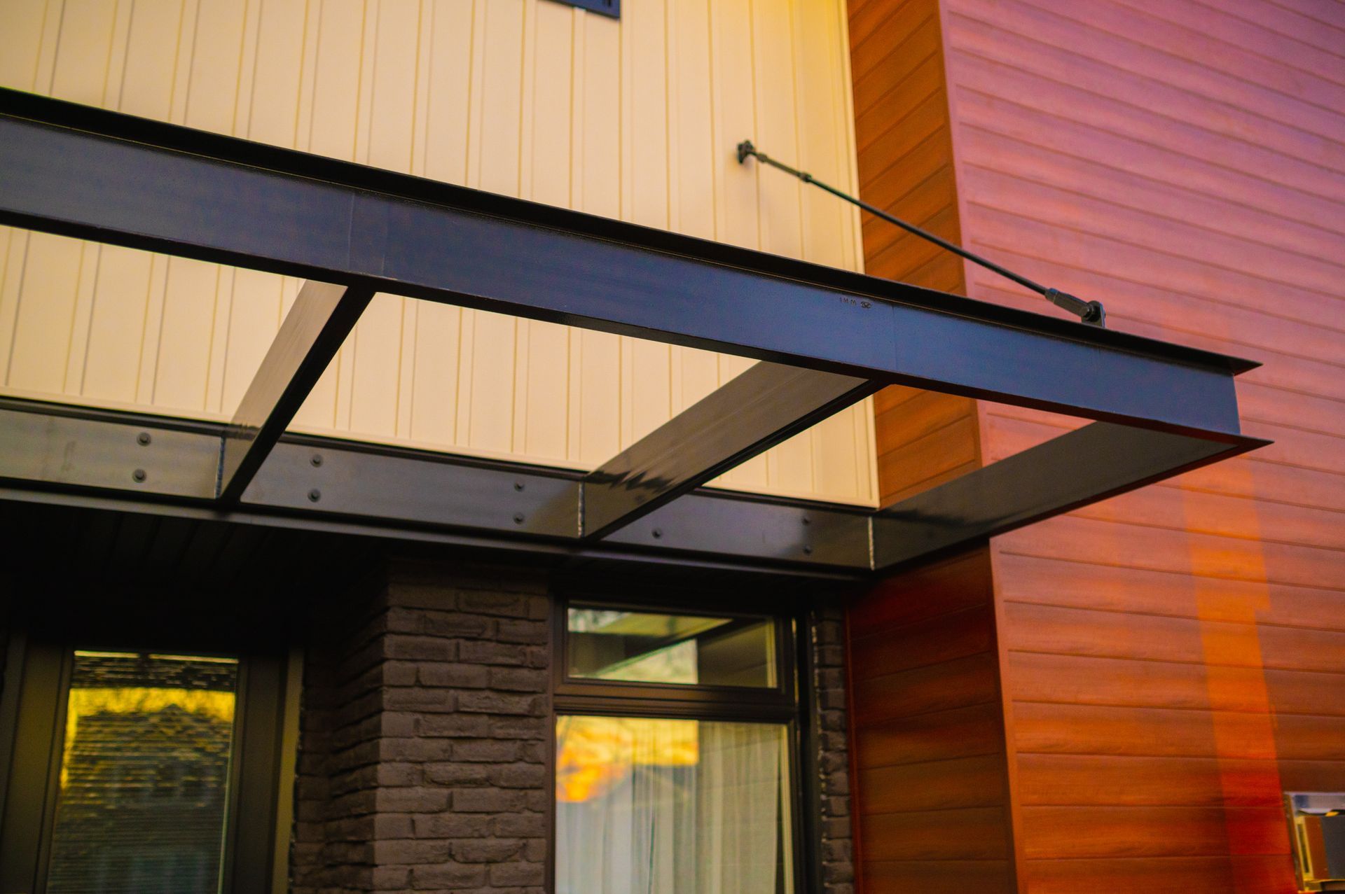 A building with a canopy over the door and a window.