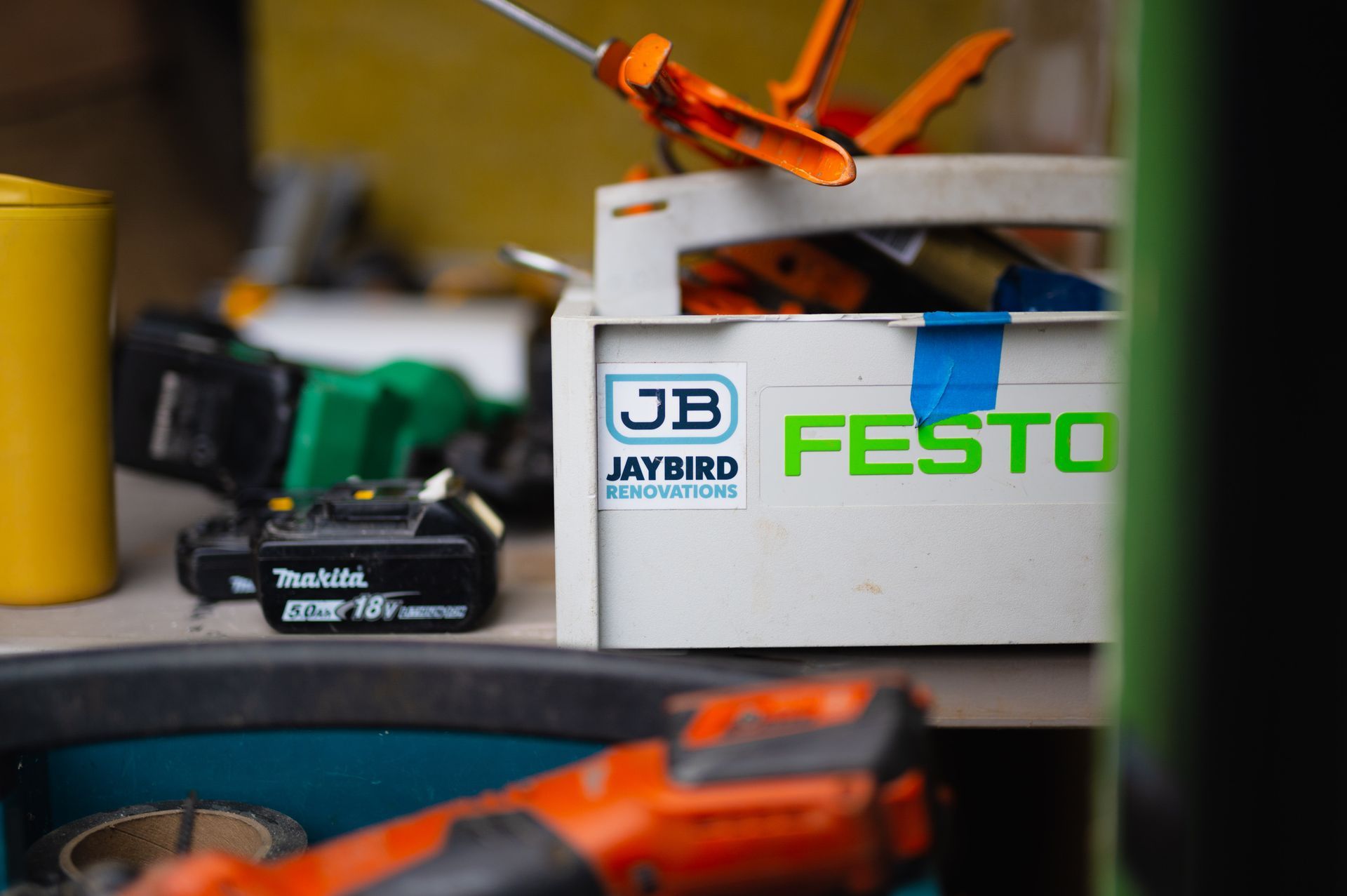 A box with jb festo written on it is filled with tools