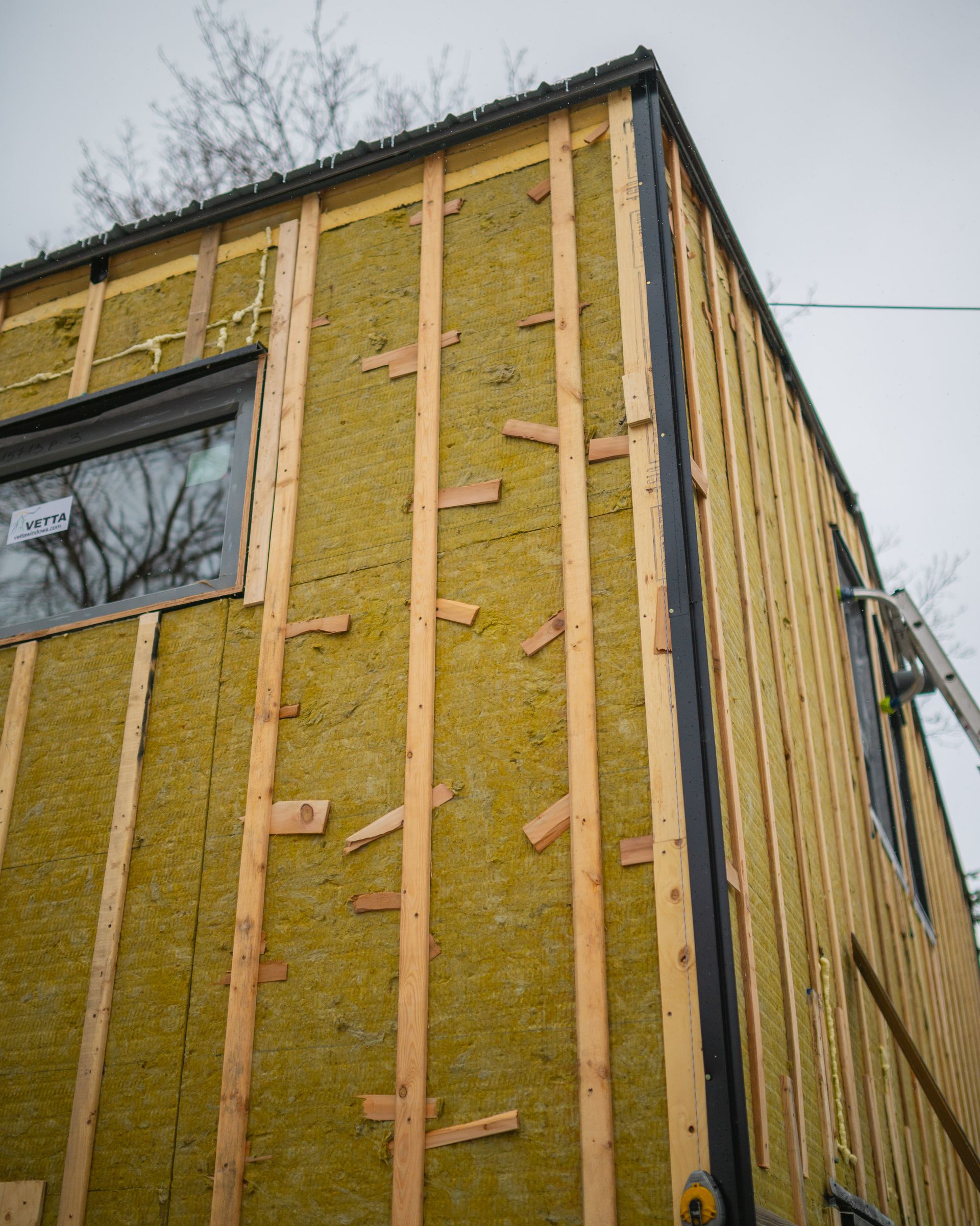 A house is being built with a lot of wood and rock wool.