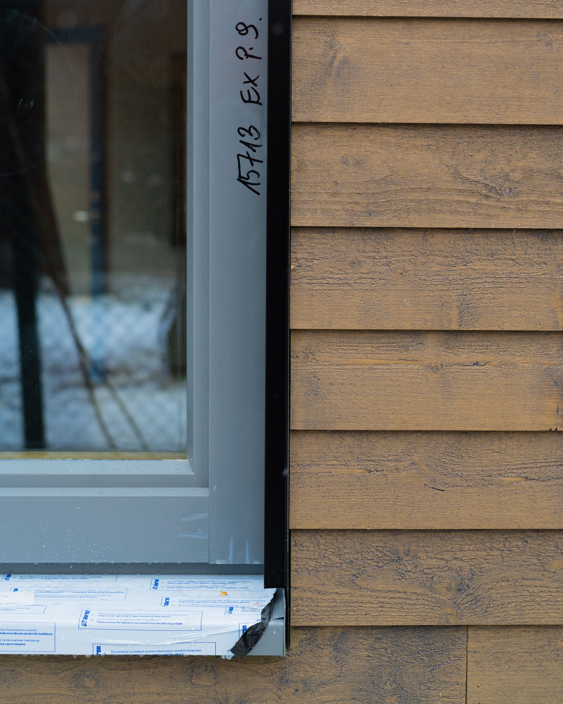 A close up of a window on a wooden building