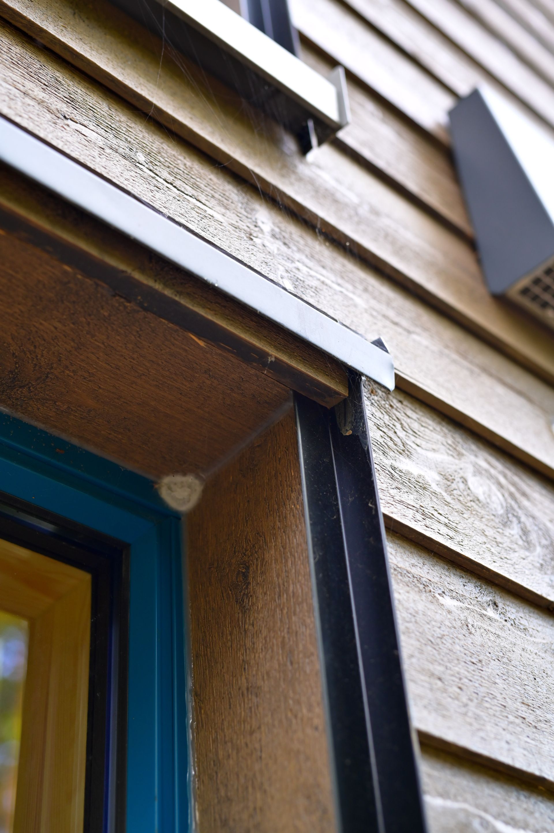 A close up of a window on a wooden building