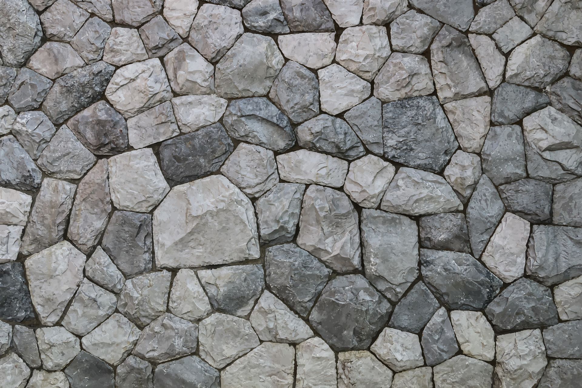 A close up of a stone wall made of gray and white rocks.