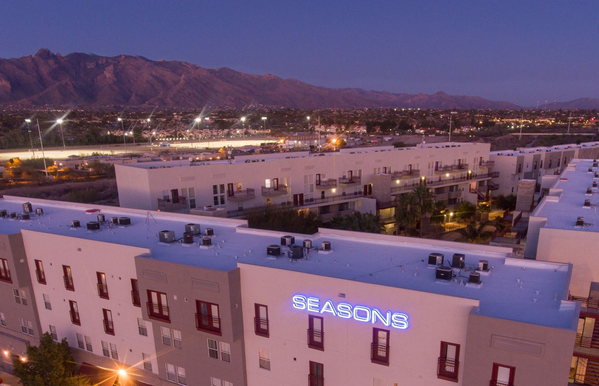 the Seasons apartments at night 