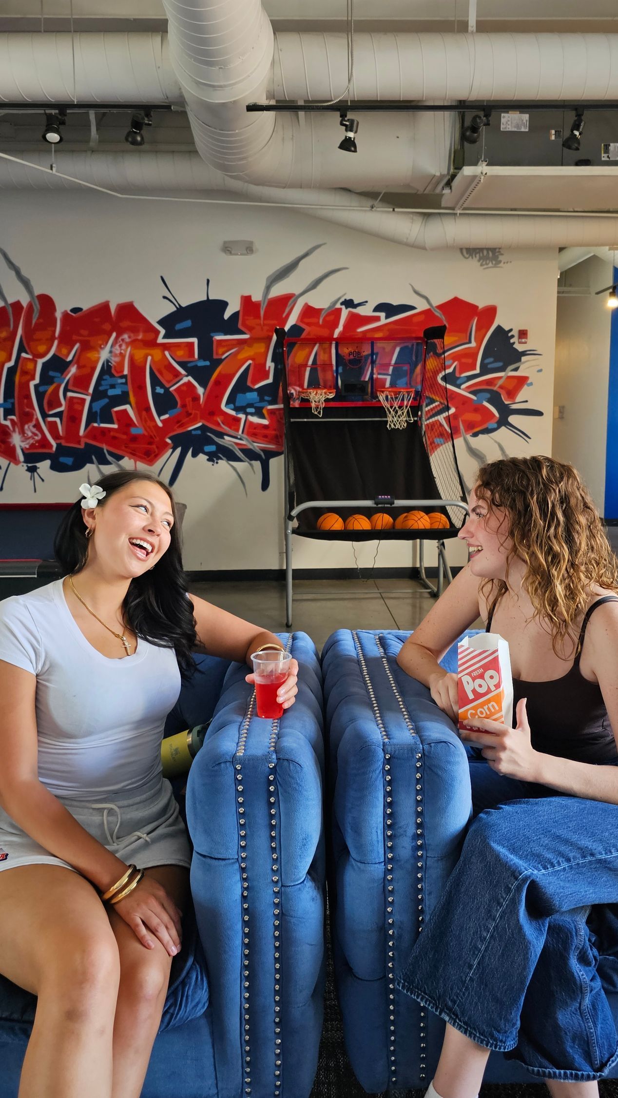 Two girls in common area laughing