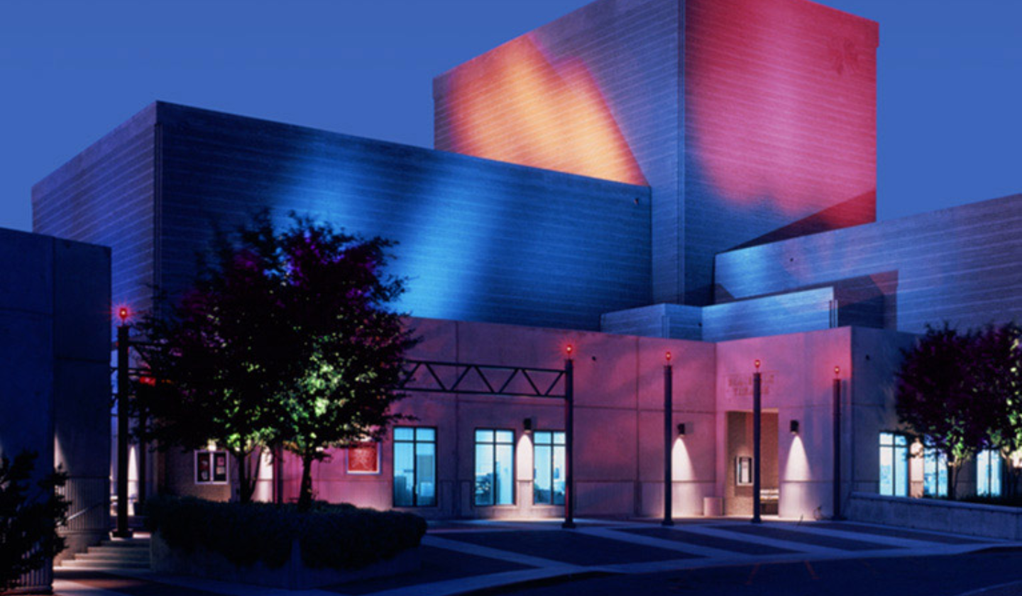 The West campus of Pima Community College lit up in the evening.