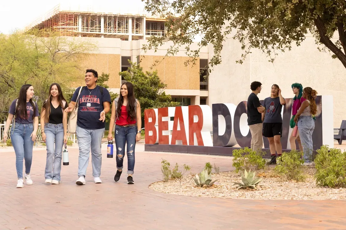 Students walking on campus at uofa