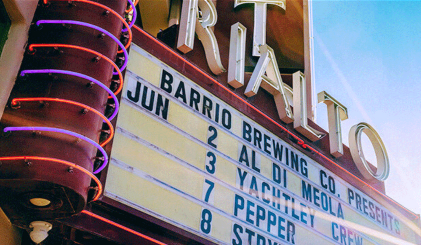 The Rialto sign with upcoming dates and performers.