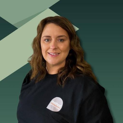 Group of people with hands together, teamwork and collaboration in an office setting.