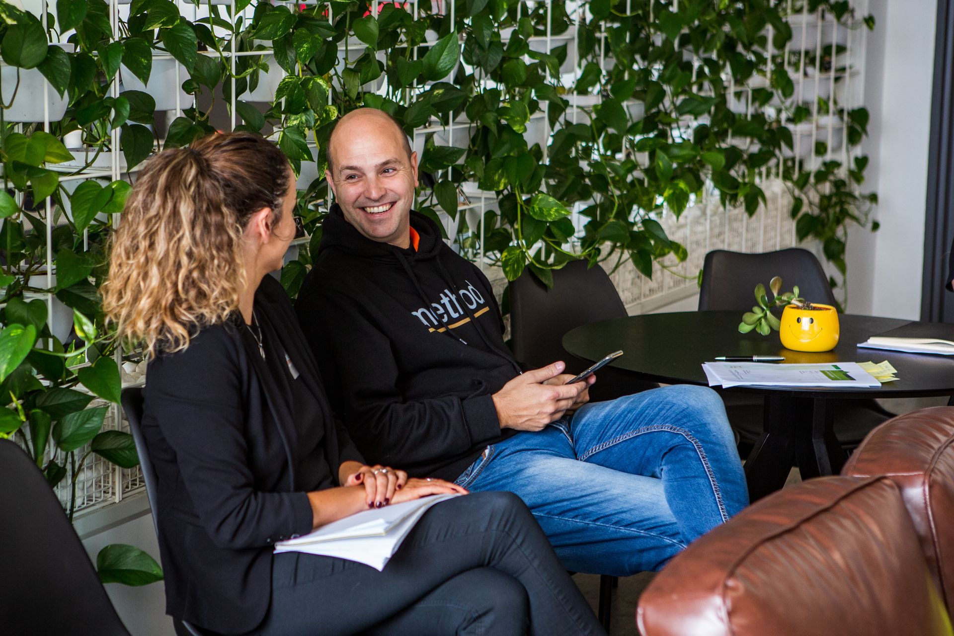 Group of six people holding signs with words like 