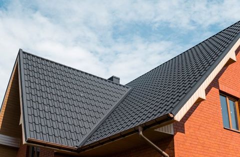 Roofing Repair — Roof of a House in Janesville, WI