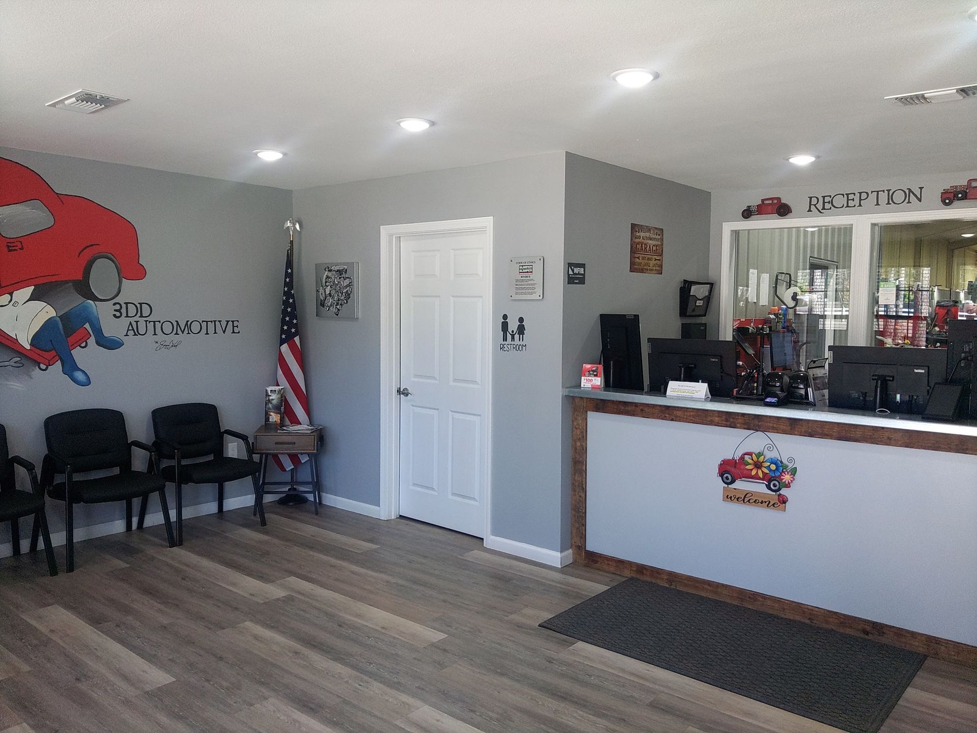Reception Area With Waiting Chairs And Front Desk Inside Auto Shop | 3DD Automotive