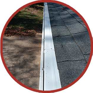 A picture of a gutter on the side of a house.